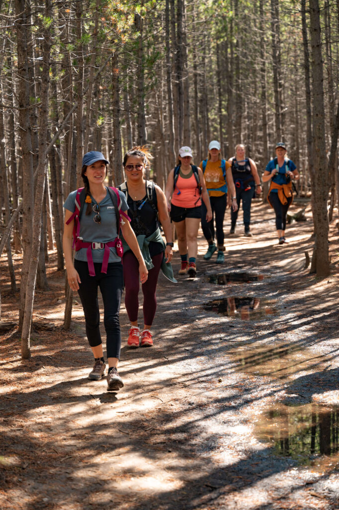 emilie leading a group of hiking women