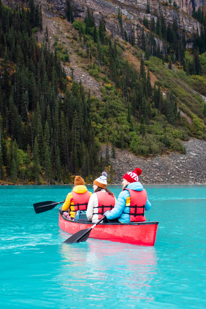 women canoying on Lake Louise